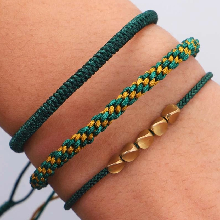 Three piece copper bracelet collection with varied bead styles and woven nylon cords