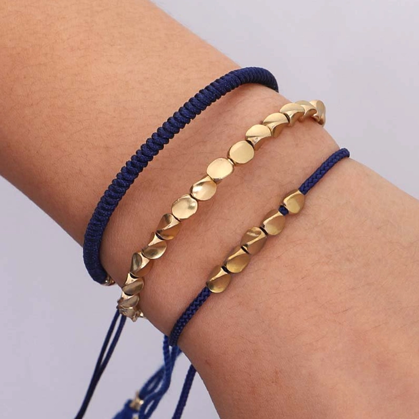 Layered copper bead bracelets worn on wrist showing wearing effect and comfort fit
