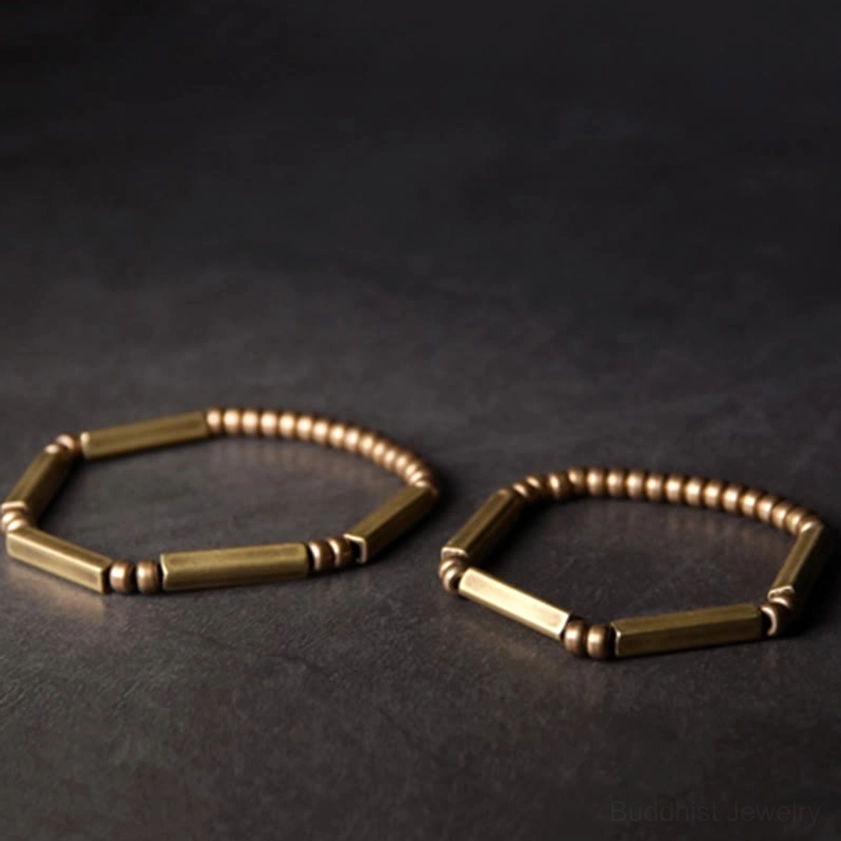 Two matching copper wealth bracelets together, pair of handcrafted brass bead bracelets for couples or gifting