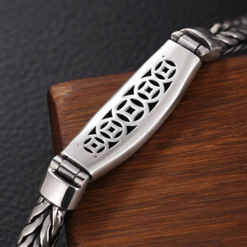 Handcrafted Buddhist copper bracelet displaying braided chain texture and vintage silver-tone finish with magnetic clasp system