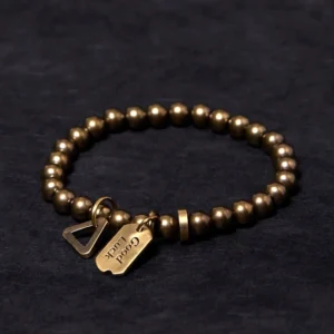 Handcrafted copper brass Buddhist bracelet front view with Good Luck charm and triangle clasp, antique bronze finish