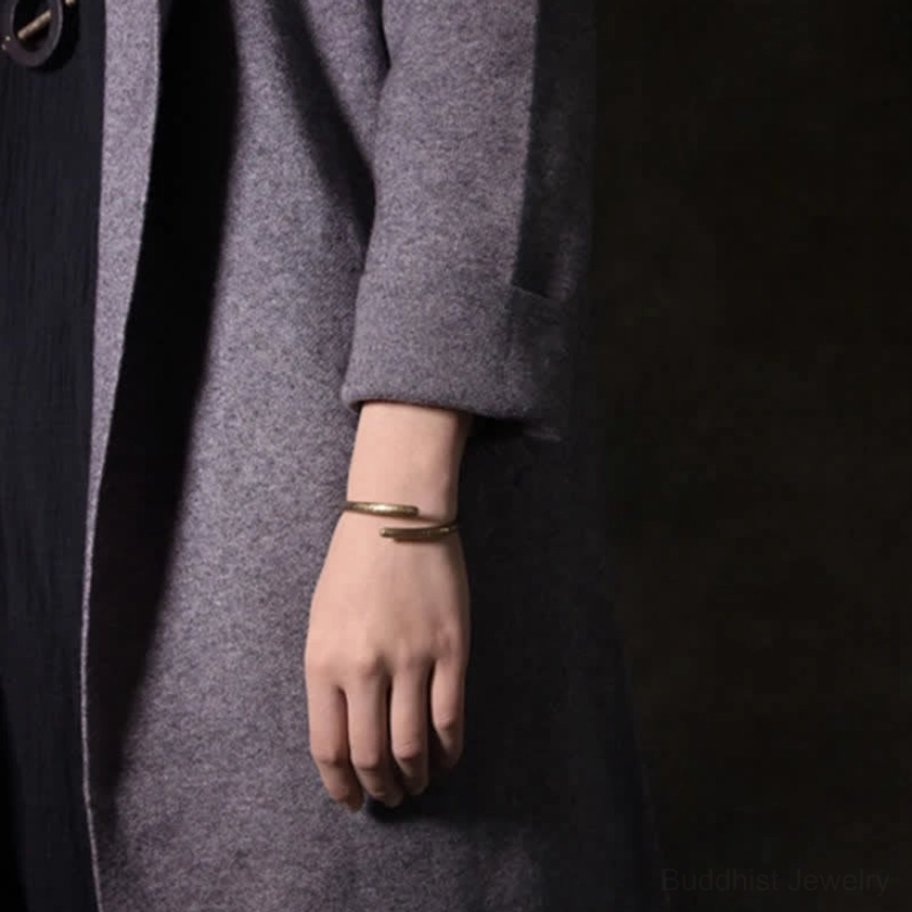 Two layered copper buddha balance cuff bracelets stacked on wrist - adjustable open design