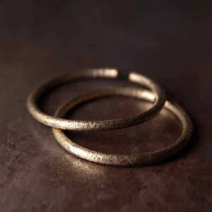 Handcrafted copper buddha balance cuff bracelets - adjustable open bangle with rustic hammered texture on dark background
