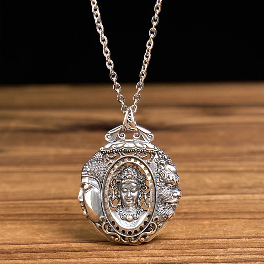 Copper Buddha pendant hanging from chain, overhead view showcasing spiritual pendant design and rope chain