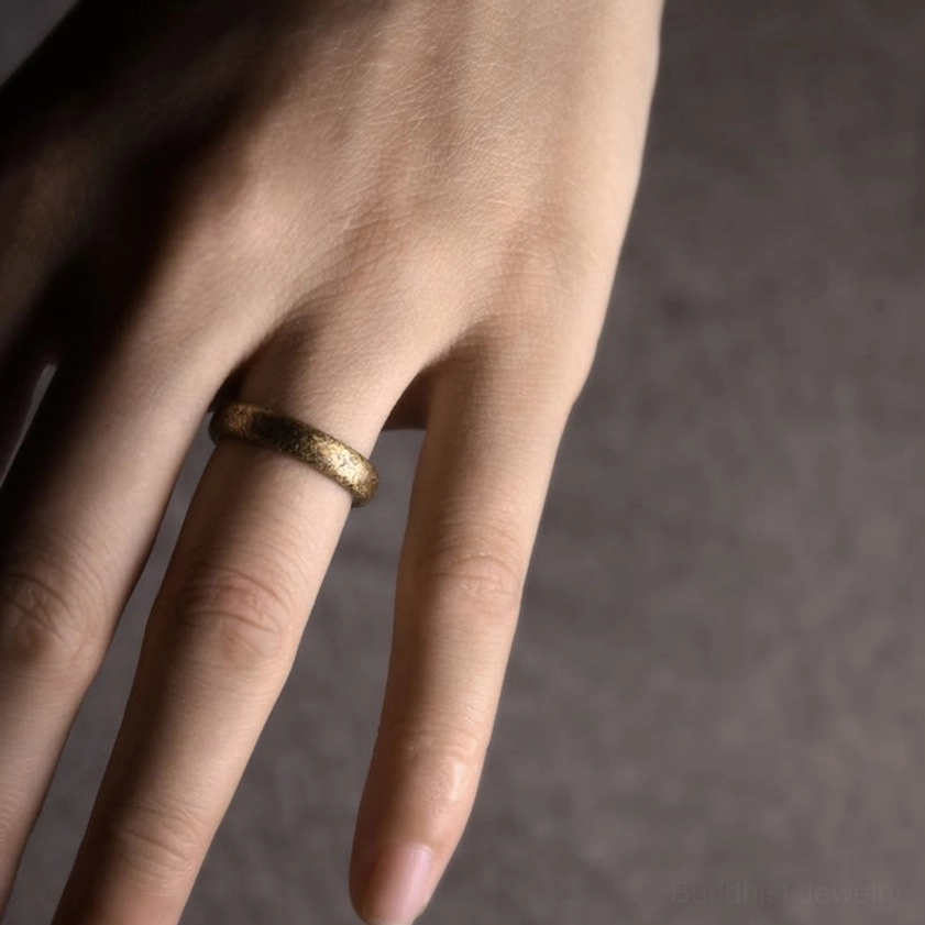 Vintage copper Buddhist couple ring with traditional etched design representing unity and prosperity