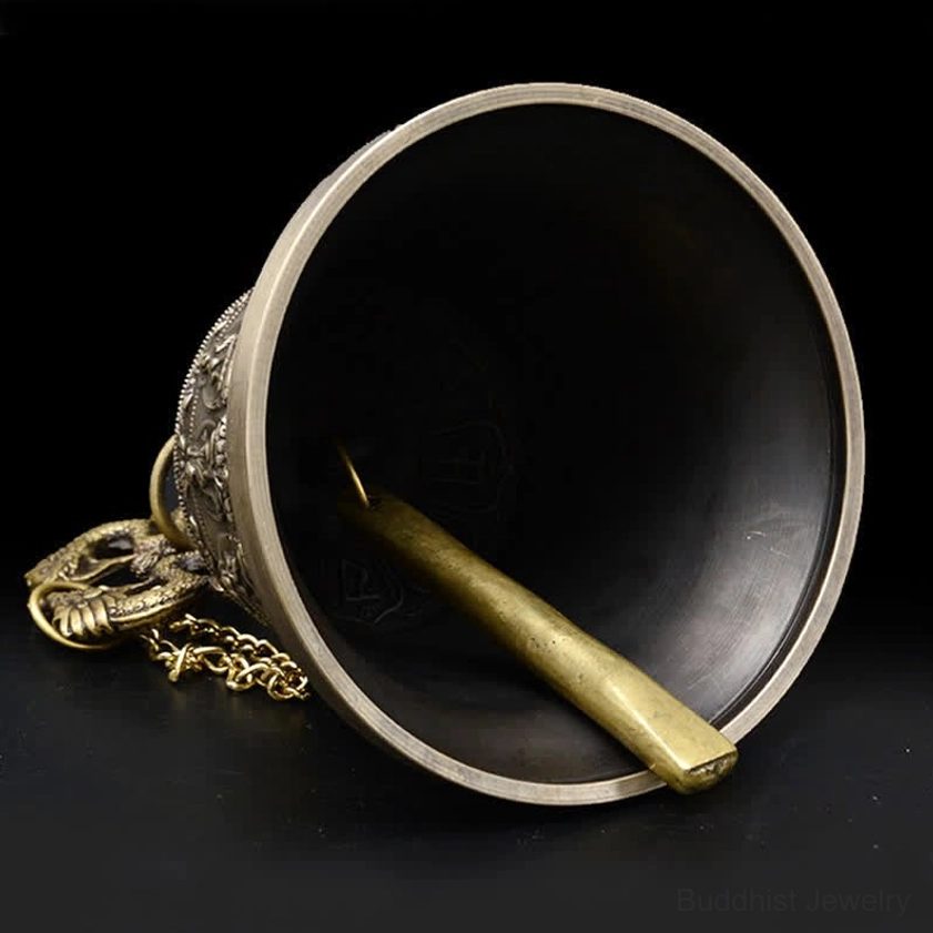 Angled side interior view revealing brass clapper and hanging hardware of meditation wind chime bell