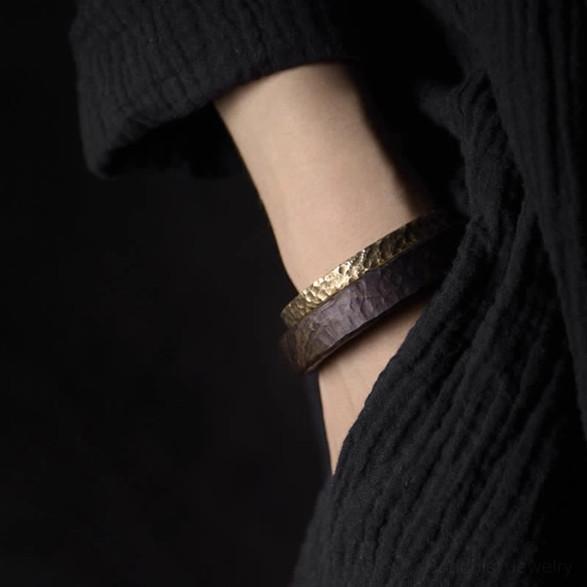 Mixed material bracelet set with hammered copper cuff combined with dark leather band for versatile spiritual styling