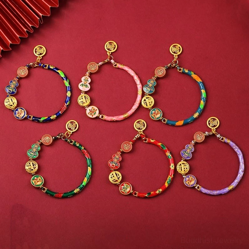 Six color variants of handcrafted copper lion gourd prosperity bracelets in red, blue, dark blue, green, pink, and purple with enamel decorations