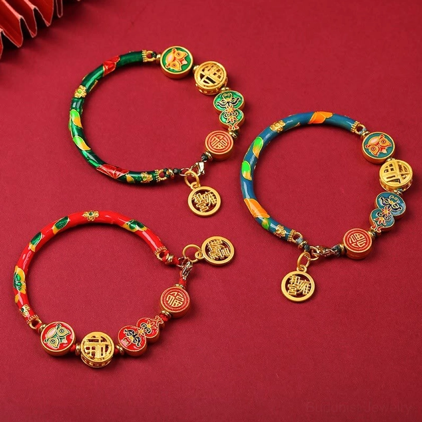 Multi-color copper lion gourd prosperity bracelets with gold charms displaying red, blue, and green enamel variants for Buddhist wealth and fortune