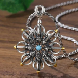 Copper lotus pendant necklace with silver finish and intricate carved details, overhead close-up view on wooden surface