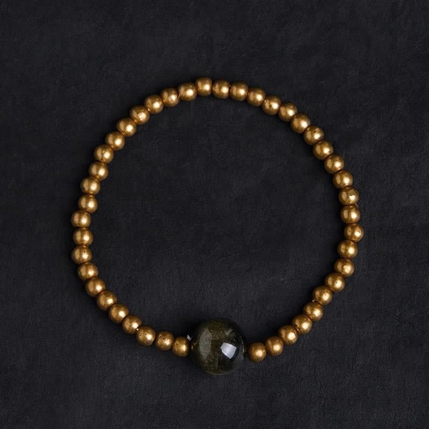 Handmade copper brass beaded bracelet with gold obsidian accent stone overhead circular display