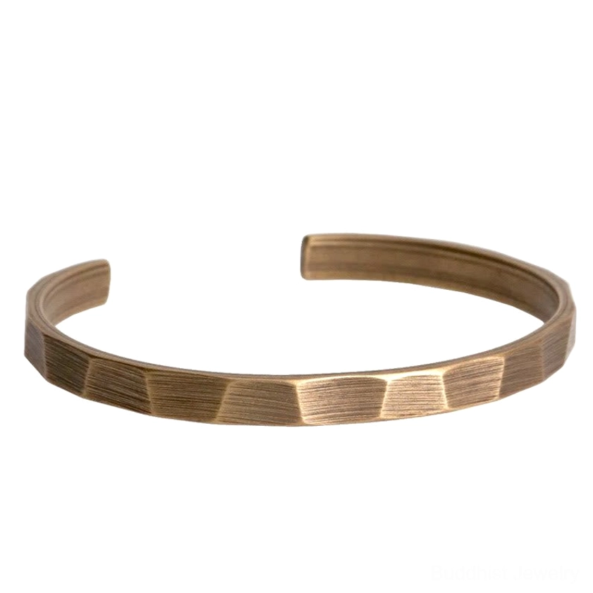 Copper prosperity bangle with antique bronze finish and clear faceted band design isolated on white background