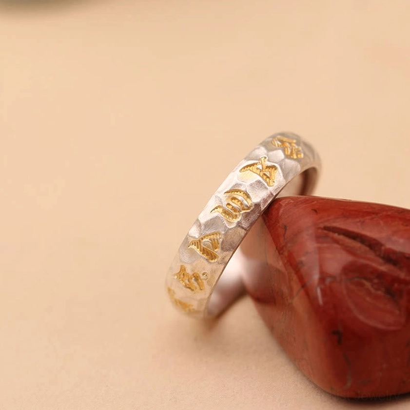 Copper plated silver ring front view displaying full Om Mani Padme Hum inscription and adjustable design