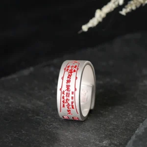 Copper talisman adjustable ring with sacred engravings shown in three-quarter side view, matte finish with red talisman patterns, open adjustable band design