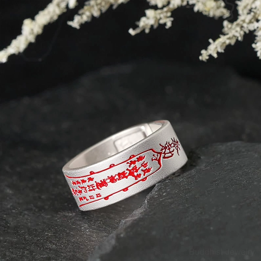 Adjustable copper talisman ring rear three-quarter view displaying back engravings and flexible band construction