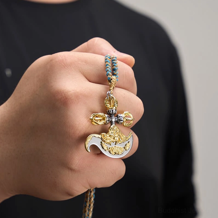 Copper vajra pendant necklace worn on hand showing pendant design and cord details
