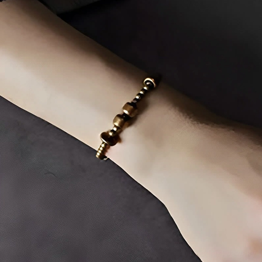 Minimalist slim copper beaded bracelet worn on wrist showing stacked bead design with antiqued copper finish
