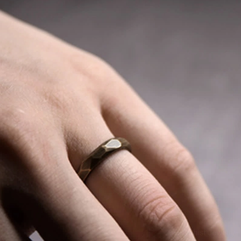 Narrow copper wealth ring side profile showing delicate band and warm antique brass tone