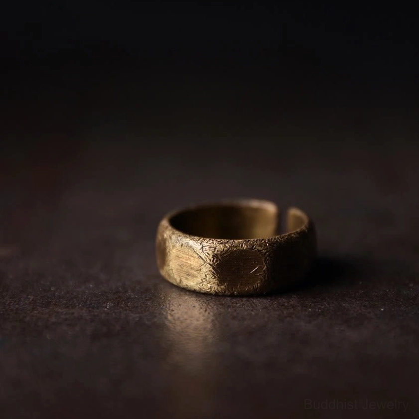Adjustable copper brass wealth ring left side profile view showing slim band and matte frosted finish