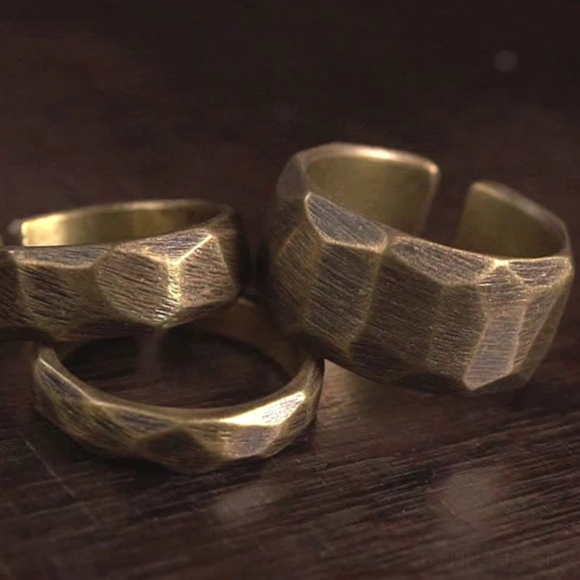 Copper wealth rings collection overhead flat lay view showing adjustable open clasp design