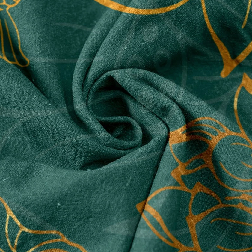 Soft dark green crumpled fabric sample showing gold oriental lotus print texture and cotton quality