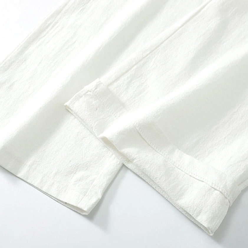 Close-up of matte cotton linen fabric weave on traditional Hanfu garment