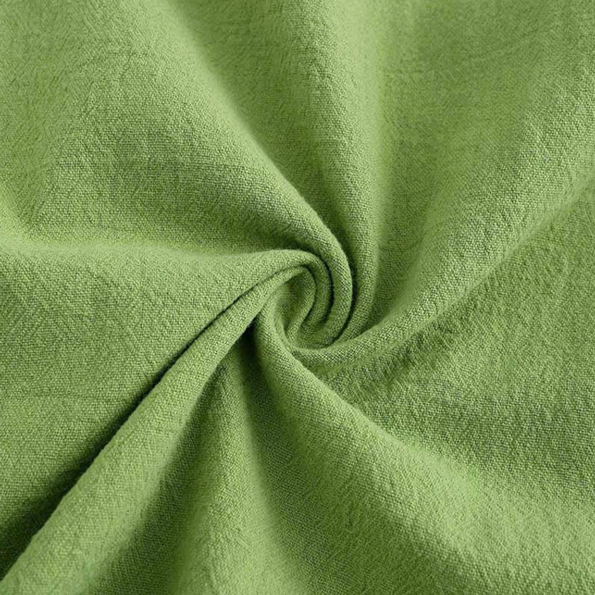Close-up detail of 100% natural cotton fabric texture for meditation clothing