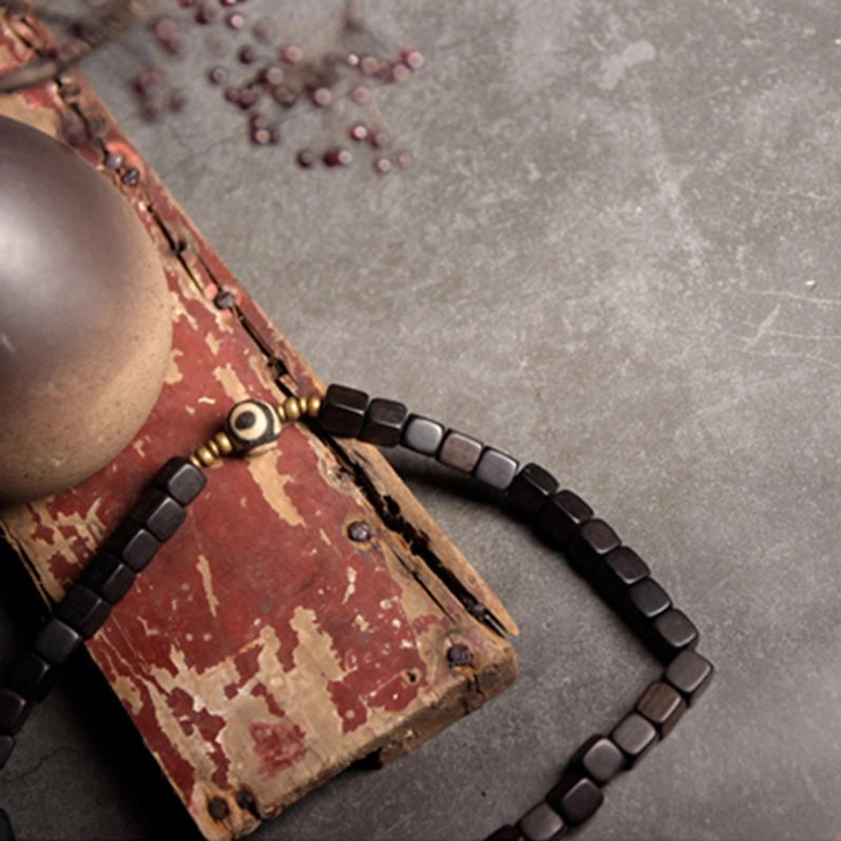 Couple bracelet set with matching ebony wood beads, bronze accents, and hand-painted dzi bead