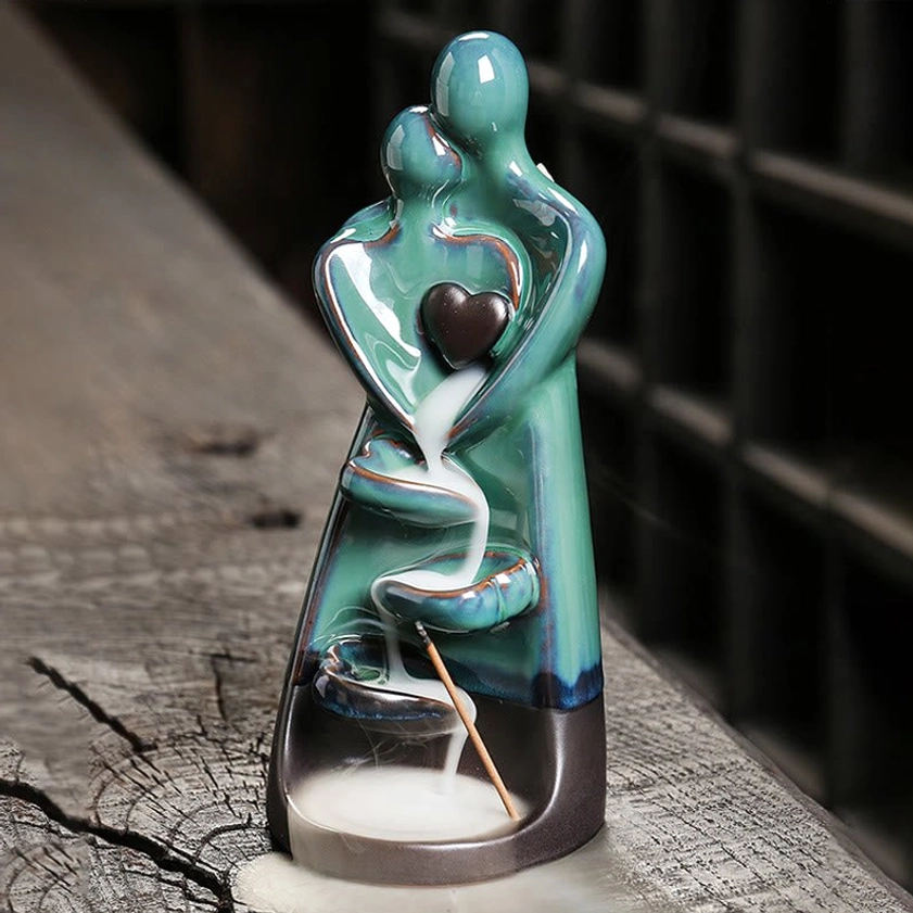 Romantic couple embrace ceramic burner with heart detail and teal glaze finish