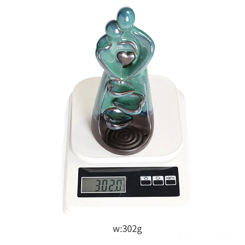 Turquoise glazed ceramic couple embrace incense holder with spiritual significance