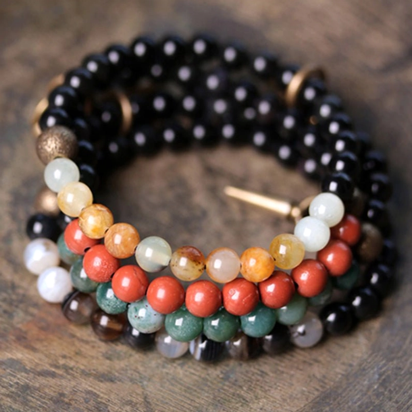 Set of two matching healing crystal bracelets with mixed natural stones and bronze spike charms