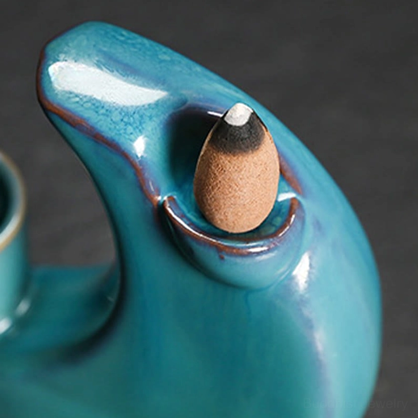 Crescent moon ceramic backflow incense burner, handcrafted meditation piece with teal glaze and brown pedestal