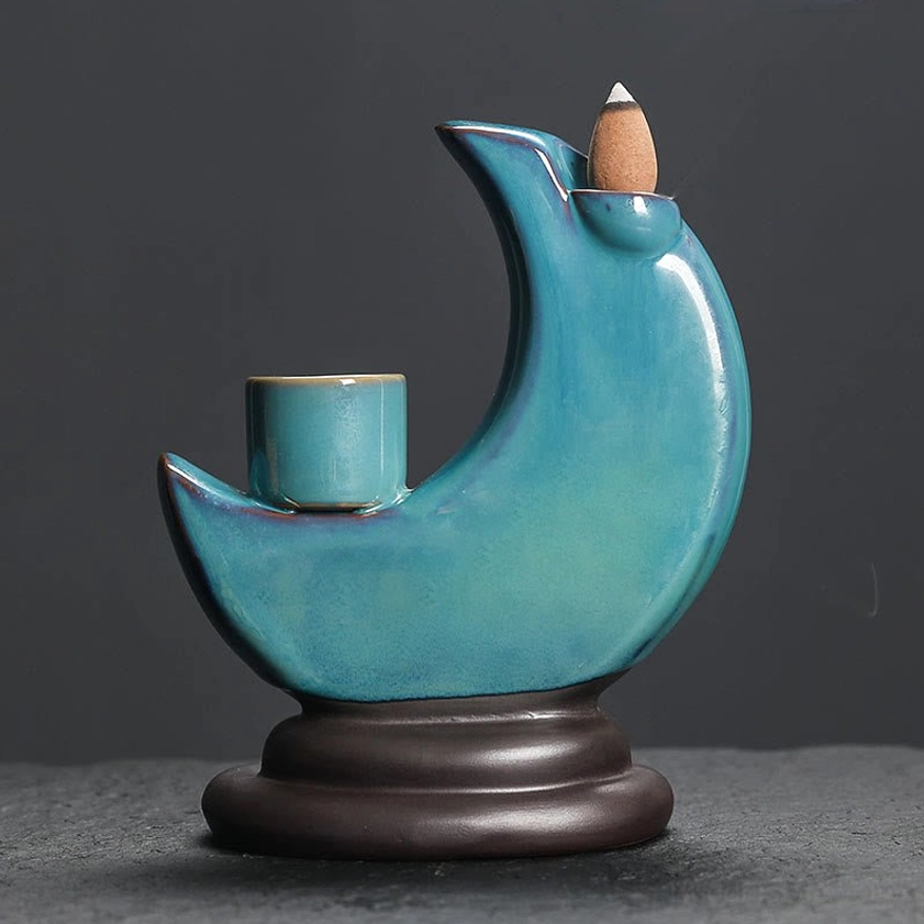 Rear view of blue crescent moon ceramic incense burner, showing detailed craftsmanship and glazed finish