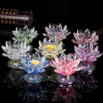 Assorted handcrafted crystal lotus candle holders in multiple colors - citrine, clear quartz, pink, green, red - top view flat lay display