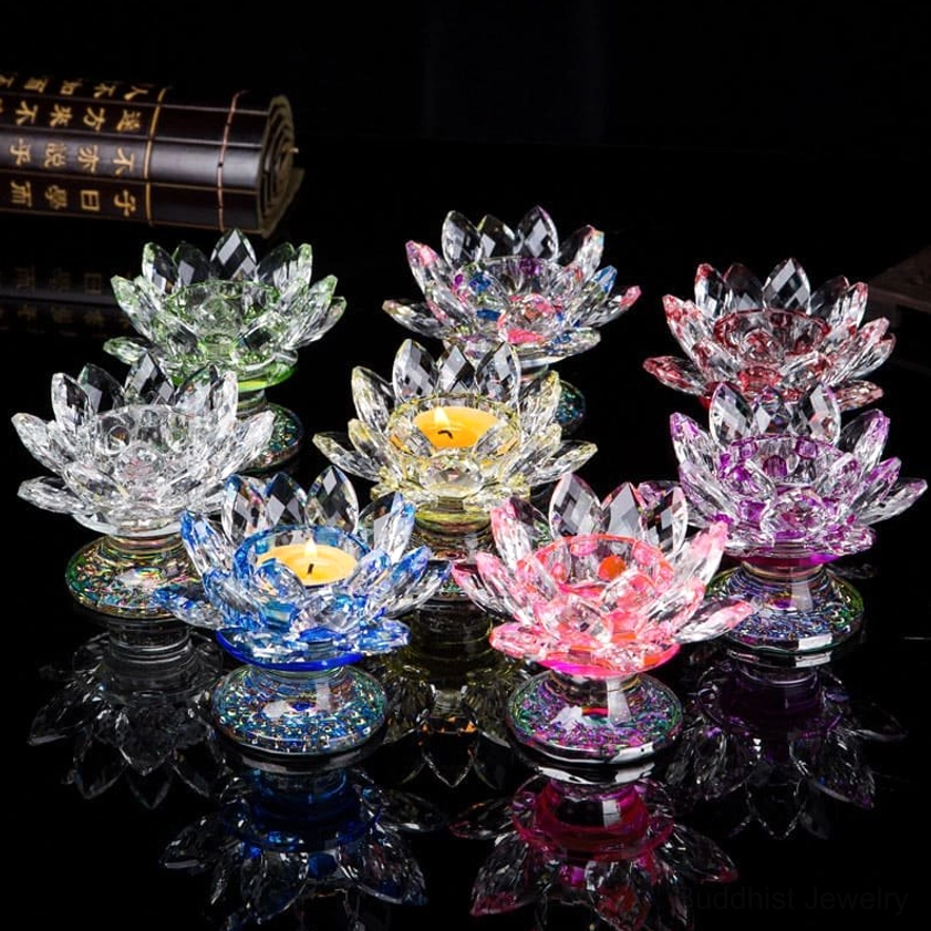 Assorted handcrafted crystal lotus candle holders in multiple colors - citrine, clear quartz, pink, green, red - top view flat lay display