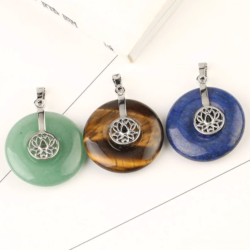 Single crystal lotus donut pendant - close-up view of natural gemstone healing charm