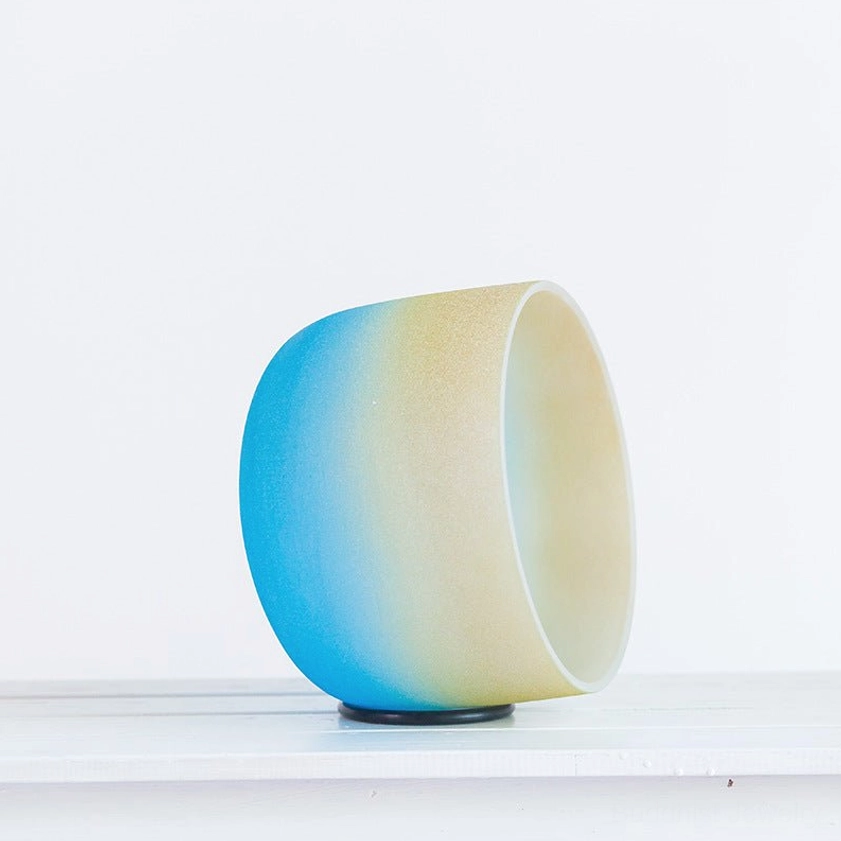 Gradient crystal singing bowl side view showing two-tone frosted finish and durability of handcrafted Buddhist sound bowl