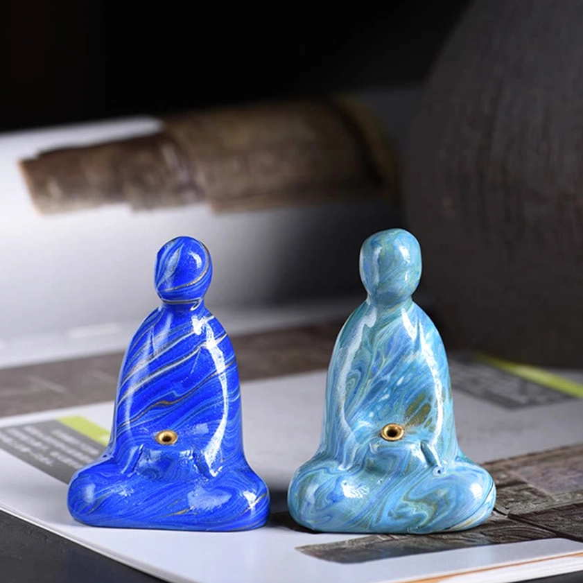 Cyan marbled Buddha incense holder detail showing handcrafted lacquer finish and smooth sculpting