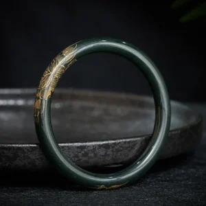 Cyan jade lotus koi fish bangle bracelet with gold engraved patterns, side view close-up