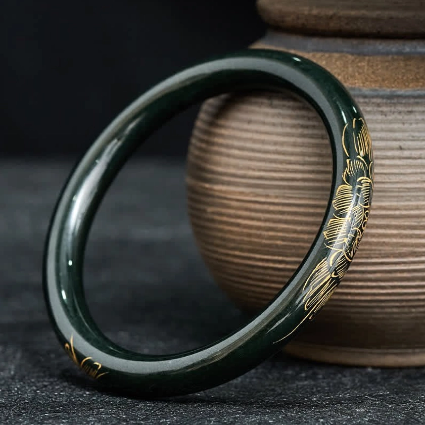 Full circumferential view of cyan jade bangle bracelet with gold lotus koi fish motifs