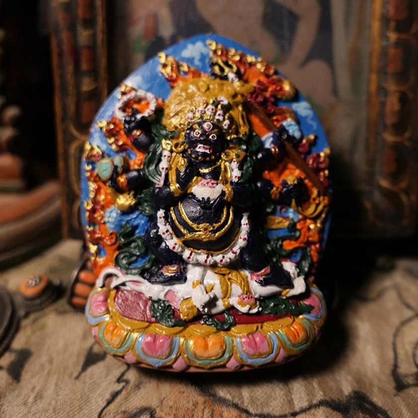 Daikokuten Mahakala wealth Buddha hand-painted clay statue with vibrant polychrome details, gilded accents, and lotus base - front view