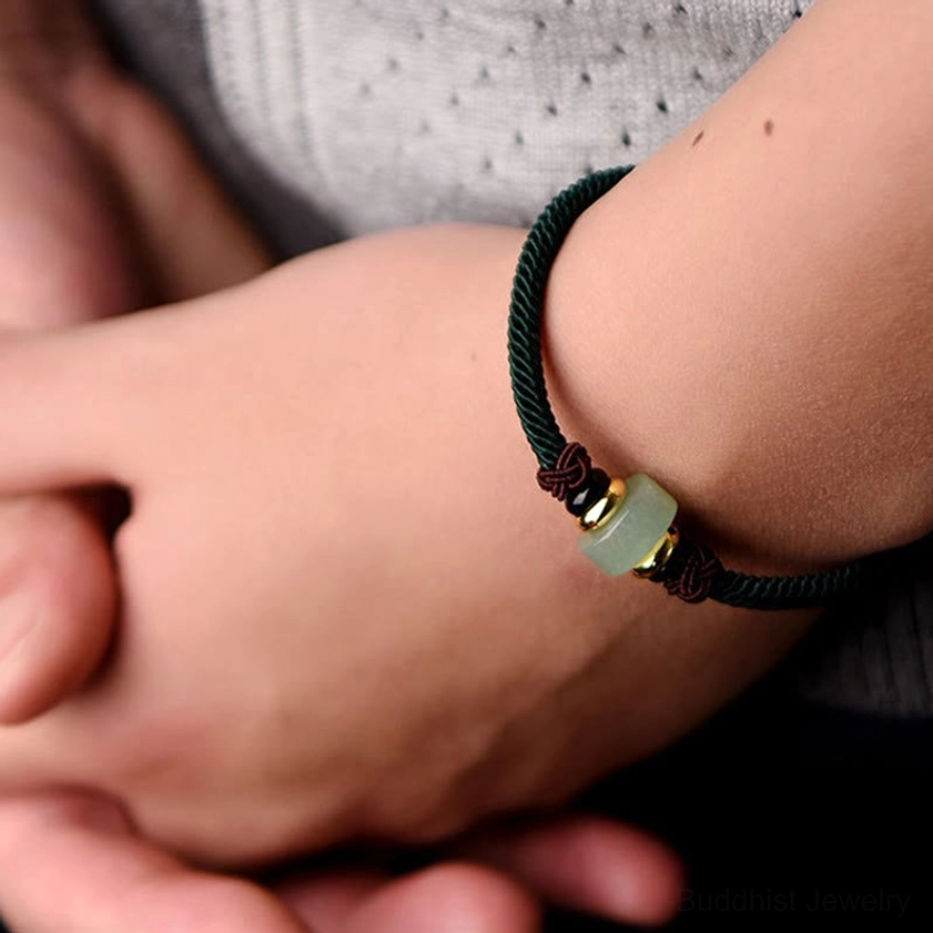 Dark green aventurine Buddhist luck bracelet with protective red string and gold-plated charm