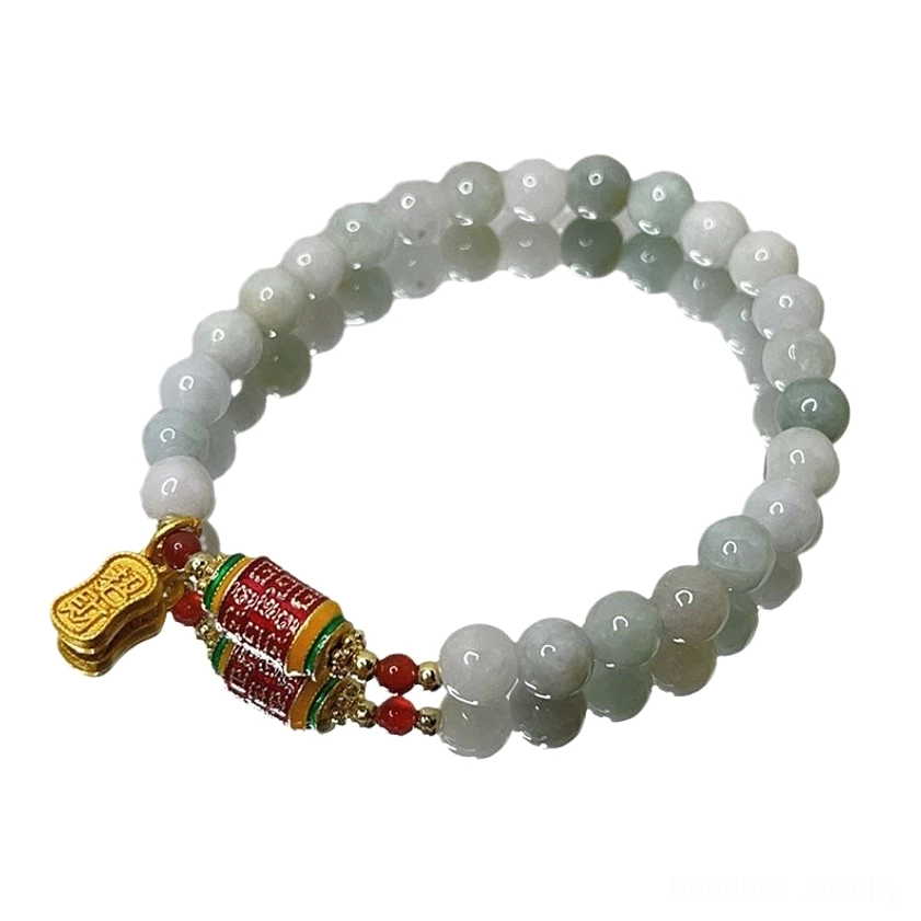Overhead close-up of dark cyan jade prayer wheel bracelet with complete Buddhist charm set