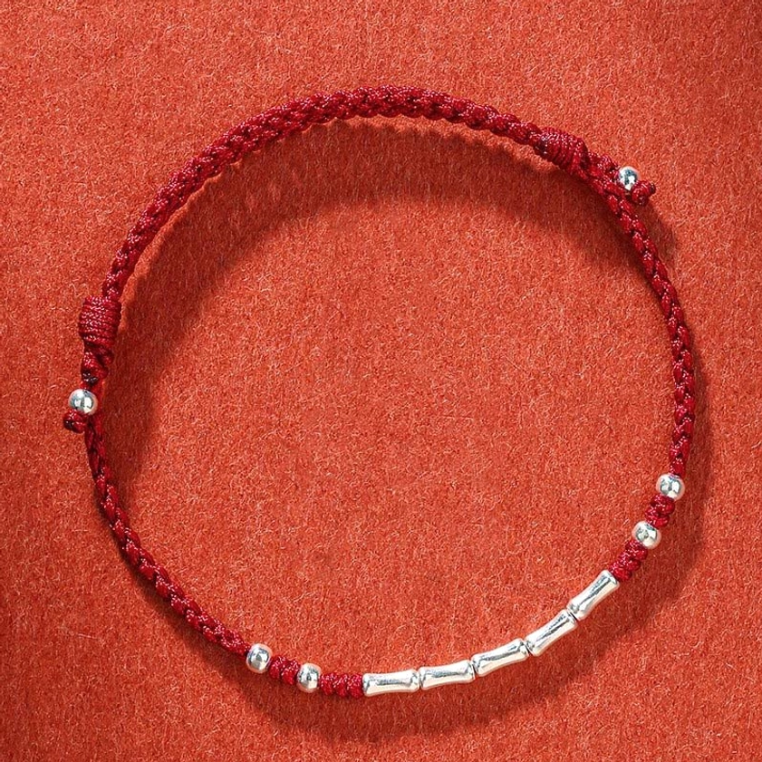 Dark red multicolored braided Buddhist bracelet with traditional knot design