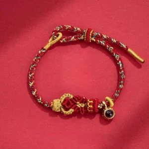 Dark Red Buddhist string bracelet with hand-woven Buddha knot and black bead charm, adjustable wrist fit