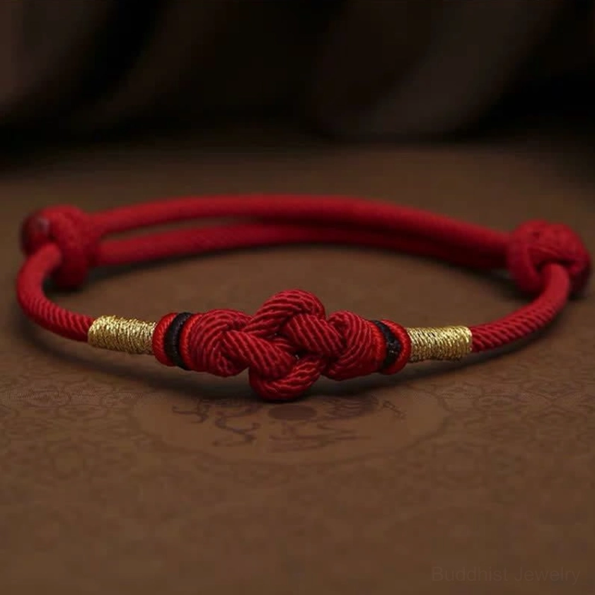 Dark red string jade bracelet variant offering deeper burgundy tone with same protective blessing properties