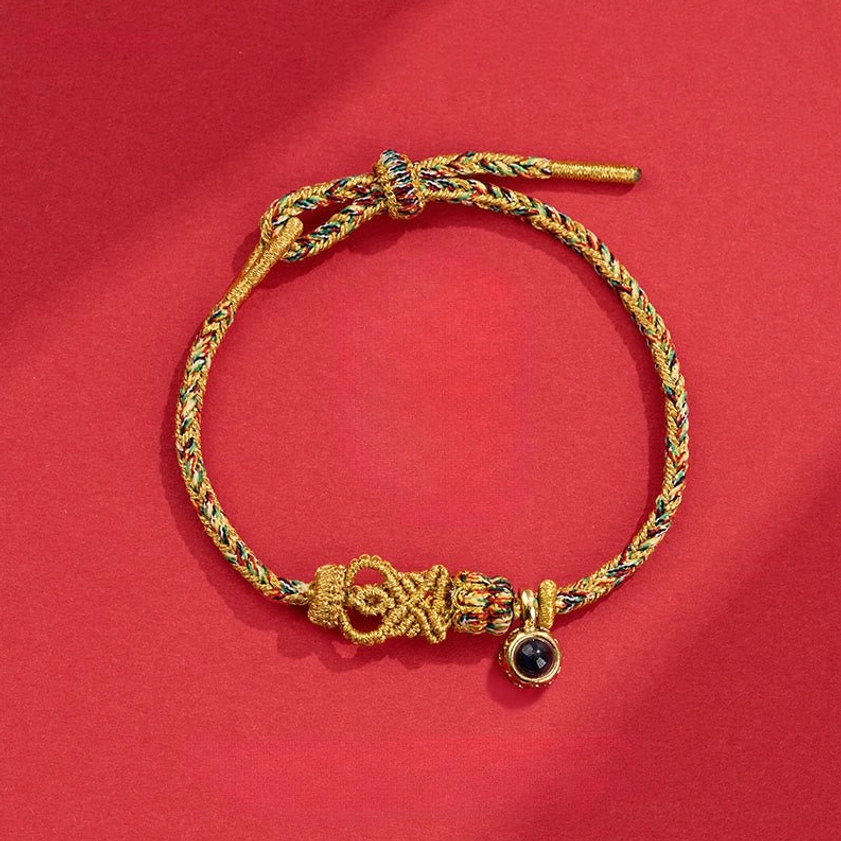 Deep Yellow Buddhist string bracelet with hand-woven Buddha knot detail and natural fiber cord