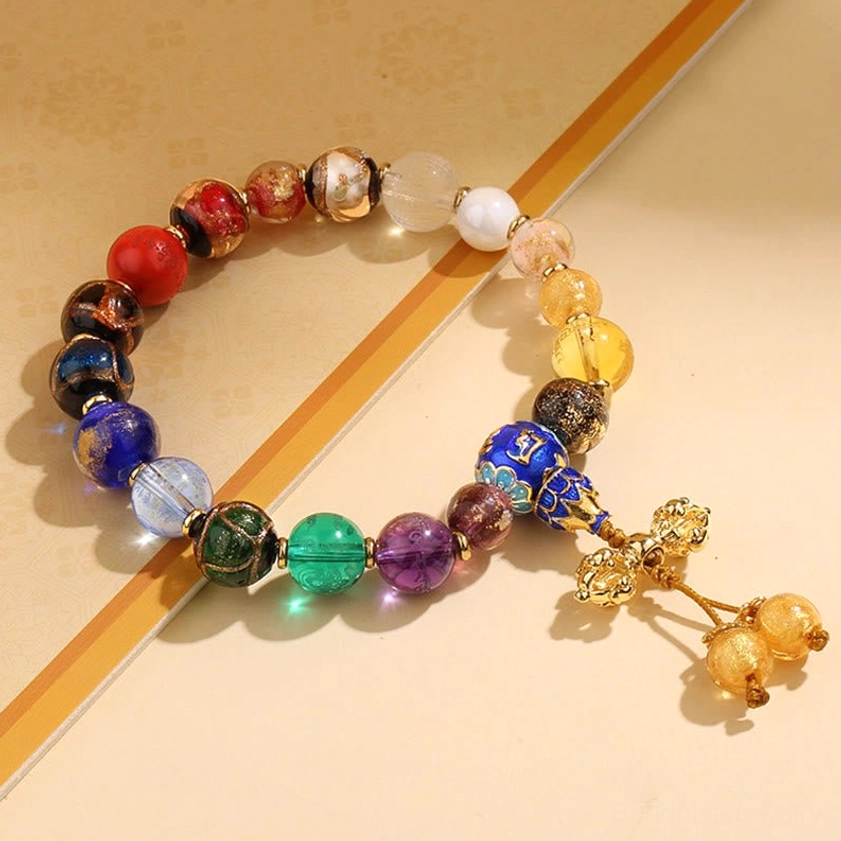 Dorje Vajra incense ash liuli glass mala bracelet with sacred Buddhist symbol pendant and golden bell tassels, spiritual protection bracelet