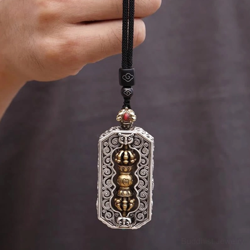 Full length Buddhist pendant necklace with engraved lotus frame and red gem accent hanging display