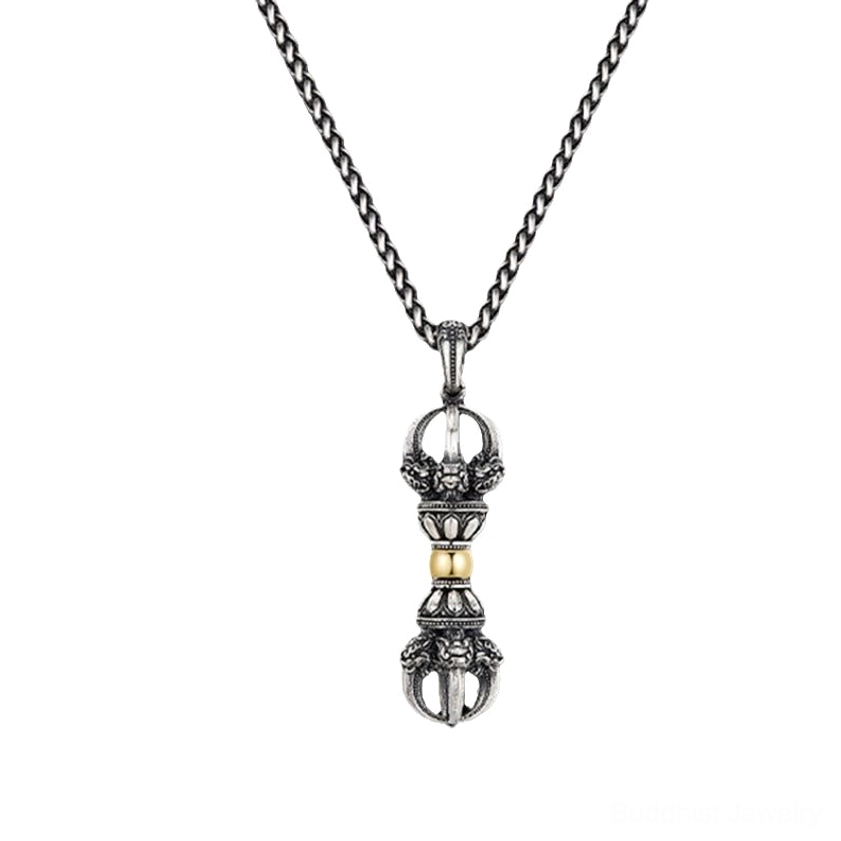 Dorje vajra Buddhist pendant necklace detail close-up showing intricate carving and vintage silver finish